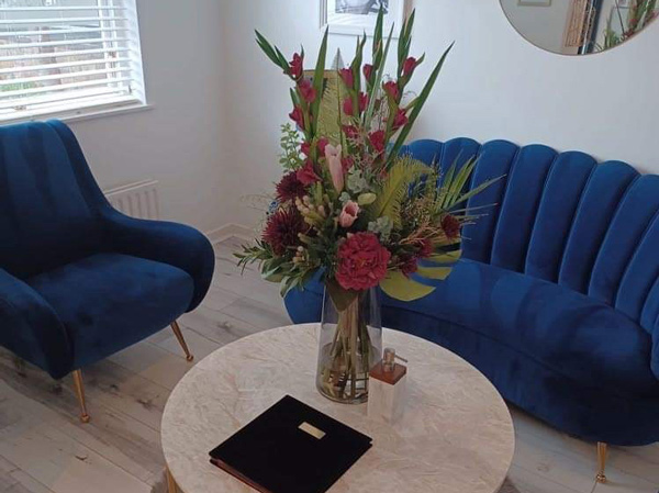 Blue sofa in private dentist surgery in Wilmslow